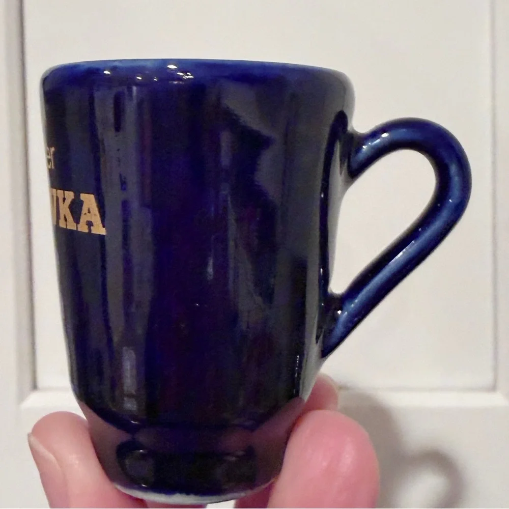 Vintage cobalt blue Karlsbader Becherovka ceramic shot glass with handle